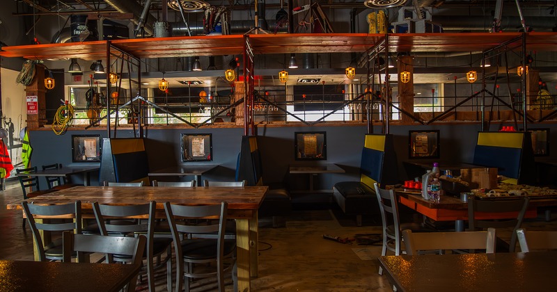 Interior space, seating area, tables, chairs and upholstered booths