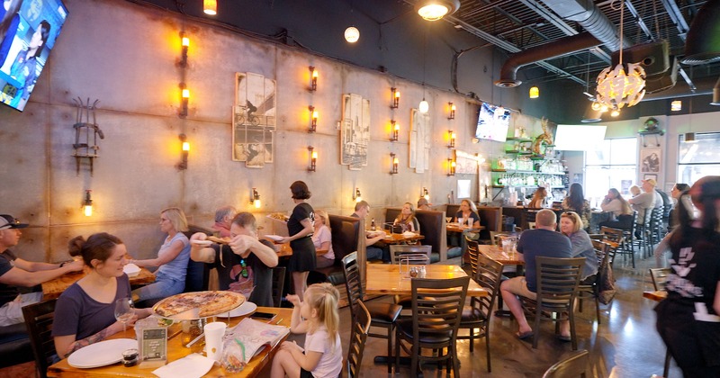 Diner area, tables and chairs, stuff, guests, ambient  light decoration