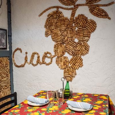 A set table next to wall decorations.