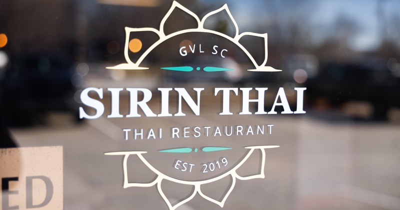 Sign on the glass on door entrance