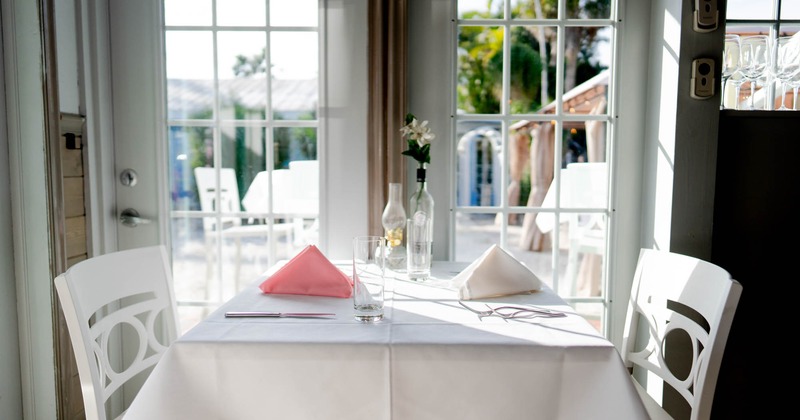 Interior, table with chairs by the windows