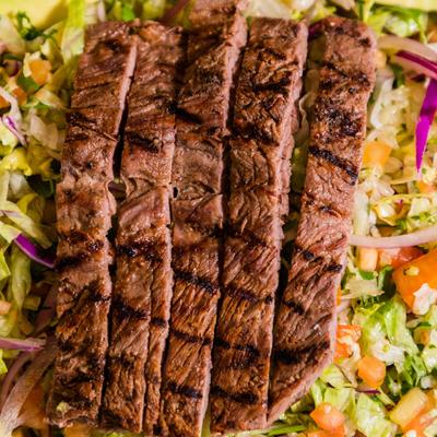 Salad with grilled steak.