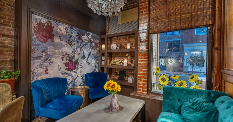 Interior, lounge area, sofa with two armchairs and a coffee table, large window