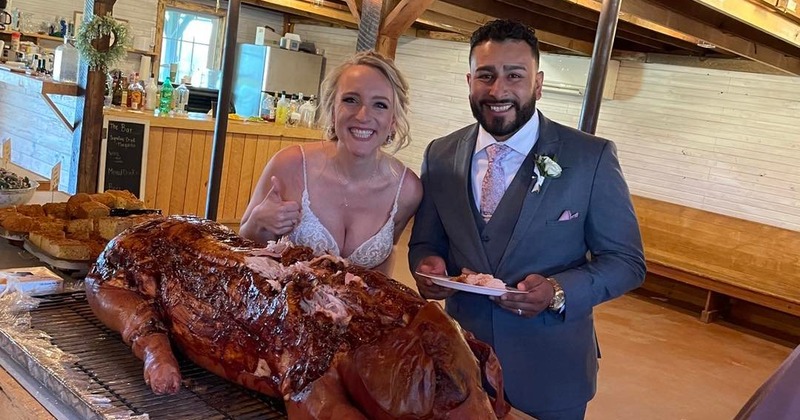 The bride and groom posing