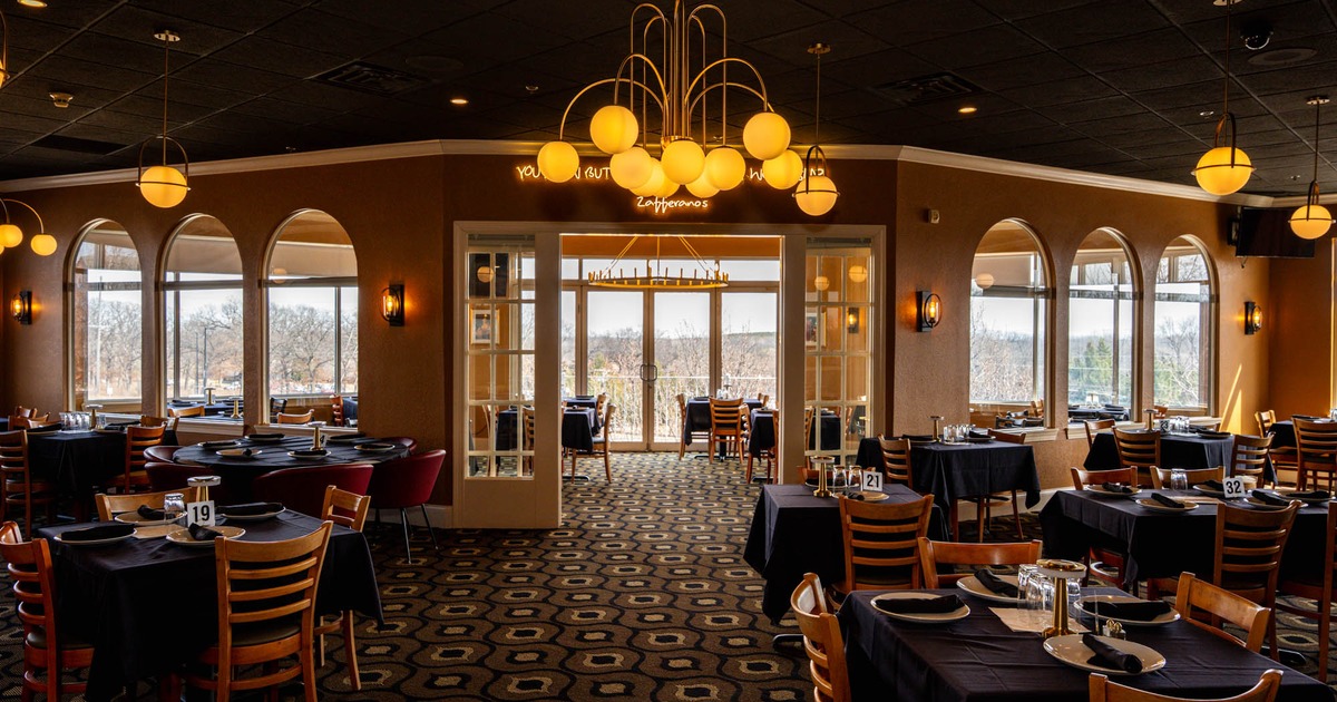 Interior, large separated open space dining areas, large folding doors, vintage chandeliers