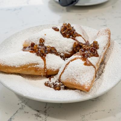 Beignets with praline sauce.