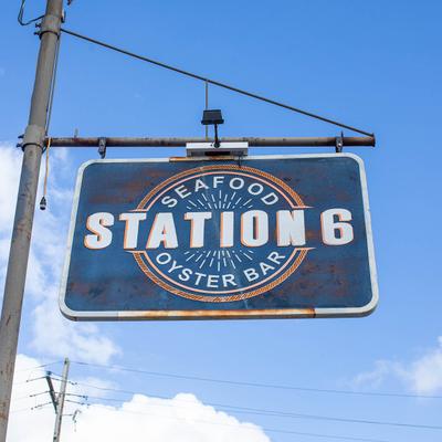 Station 6 hanging  sing outside.