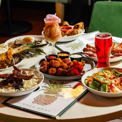 Assortment of dishes served on a table with drinks.