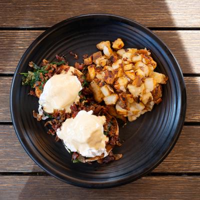 Eggs Benedict and potatoes.
