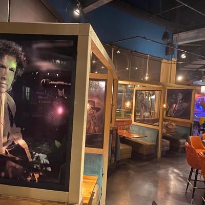 Interior, photos of famous musicians on every table