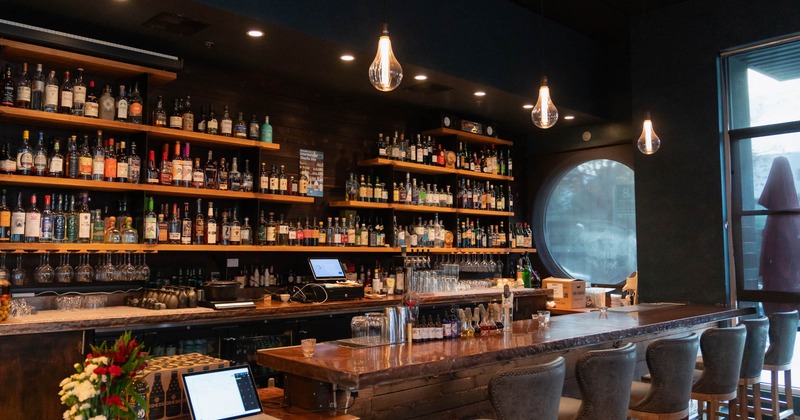 Interior, a bar with drink shelves in the back