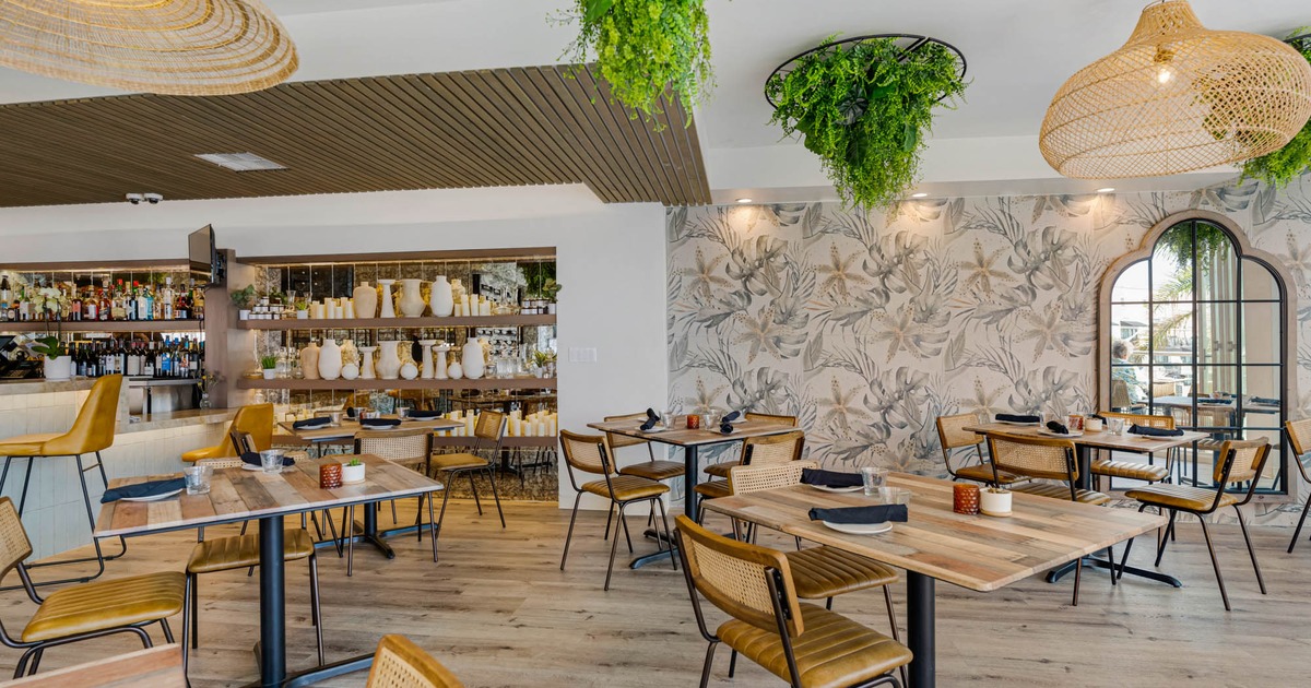 Interior, seating area, floral wallpaper decorations on the wall behind