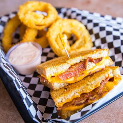 Grilled Cheese with Bacon Sandwich basket with Onion Rings and ranch dip