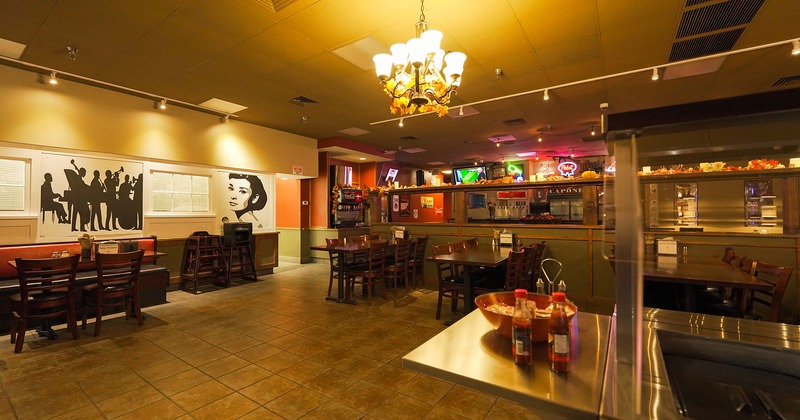 Interior, tables, chairs, counter, refrigerated display cases, wall decorations, lighting