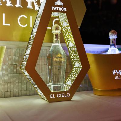 Tequila bottle displayed in a hexagonal frame.