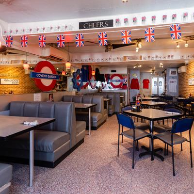 Interior, booths, lined up dining tables, British decor