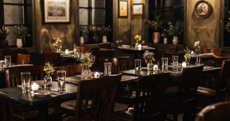 Interior, set tables with tableware and glasses lined up