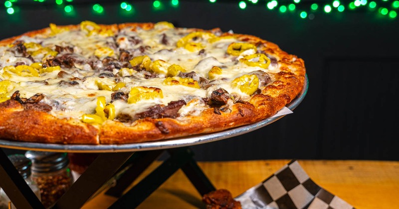 Three cheese steak pizza and wings