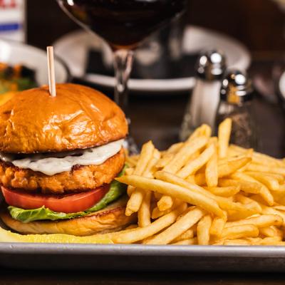 Salmon burger with fries.