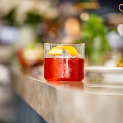 Negroni cocktail with an orange peel.