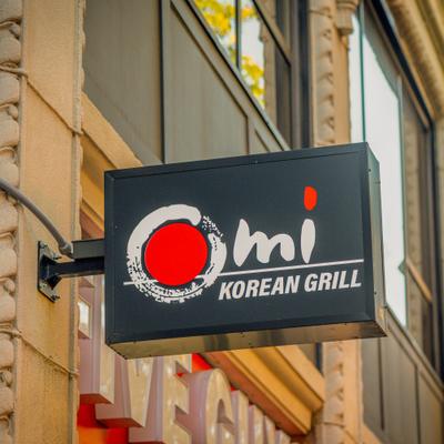 The restaurant's sign on the side of a building.