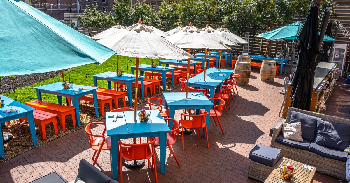 Exterior, colorful tables, chairs, benches and parasols