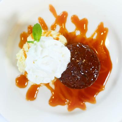 Sticky Toffee Pudding, with vanilla ice cream, and whipped cream.
