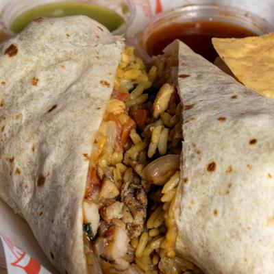Grilled chicken burrito with rice, beans, and grilled veggies.