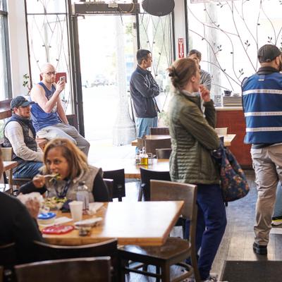 Customers in the restaurant dining and drinking.
