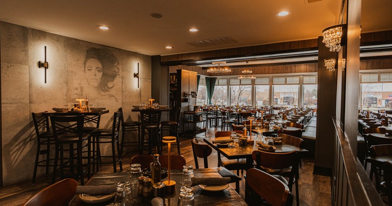 Interior, dining area, regular and high seating tables for four, ready for guests