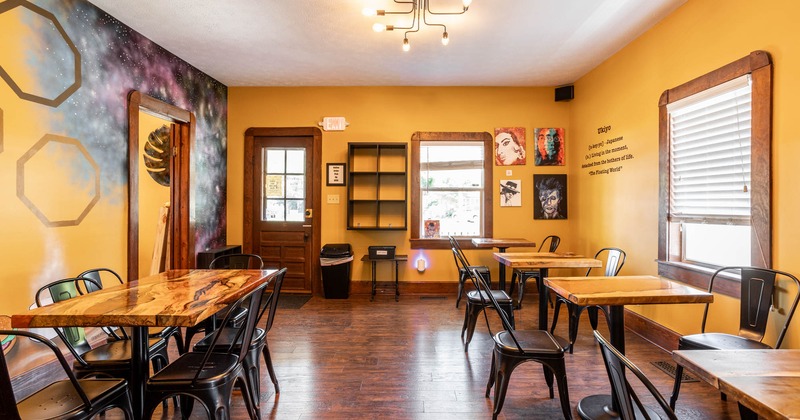 Interior,, seating area, wooden flooring, entrance, abstract mural and paintings as decoration