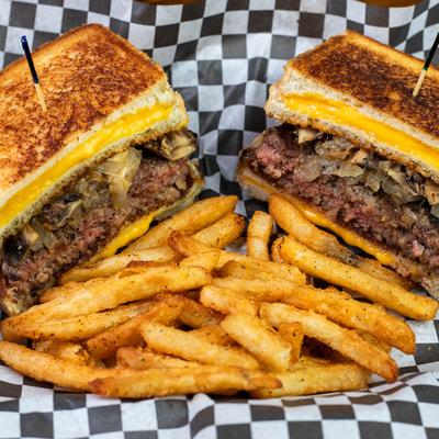 The Chubby Melt sandwich served with fries.
