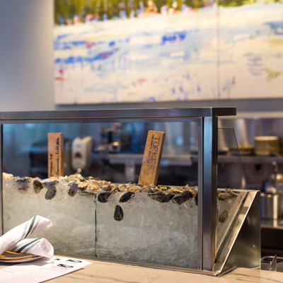 view of oysters displayed on ice in oyster bar