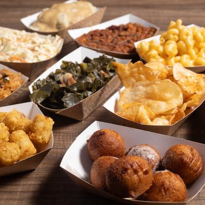 Assorted sides displayed on table.