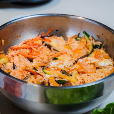 Bibimbap served in a stainless steel bowl.