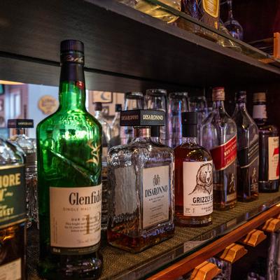 Assorted whiskey bottles.