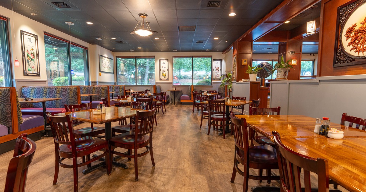 Interior, dining area, wooden top tables with wooden chairs, booths, ready for guests