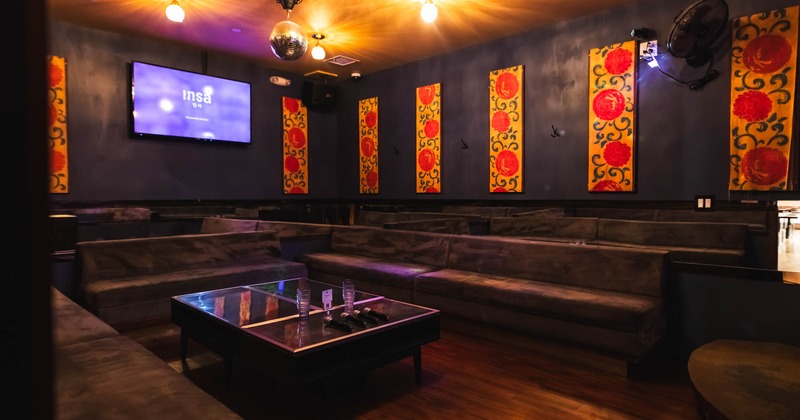 Karaoke room with a TV, traditional wall decoration