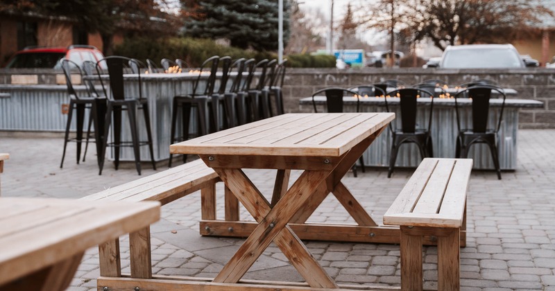 Exterior, wooden table and bench ready for guests