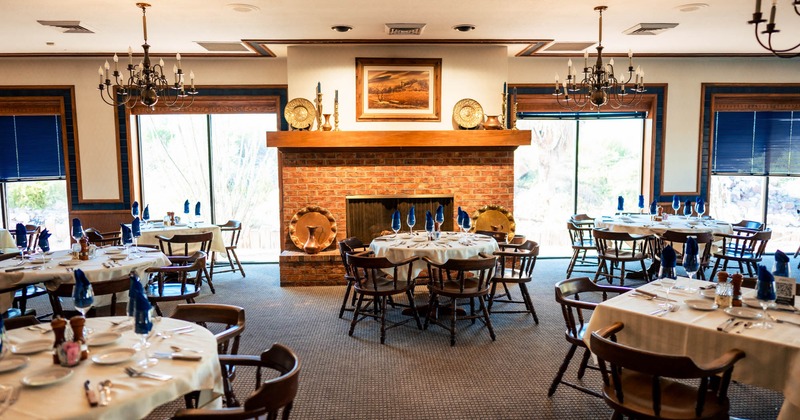 Interior, seating area with a fire pit in the back