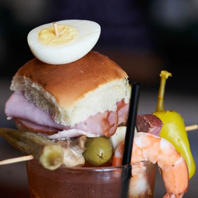 Loaded Bloody Mary with various toppings.