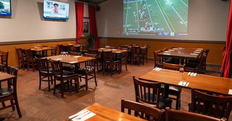 Interior, seating area with TV screens on the wall