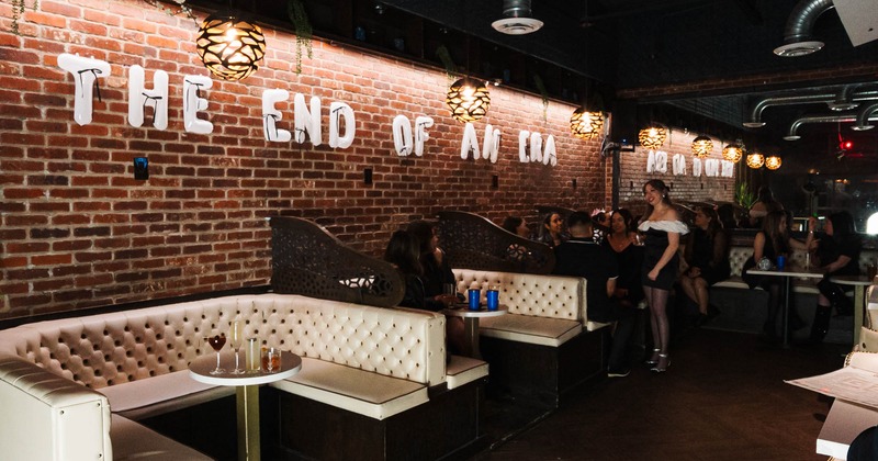 Interior, tables and white leather seating booths
