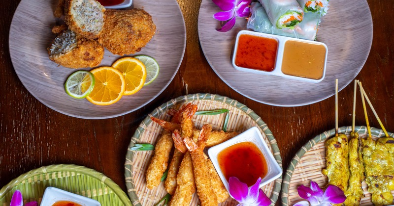 Multiple food dishes displayed on table, top view