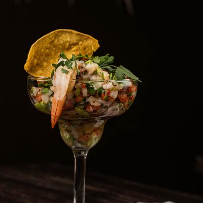 Shrimp ceviche served in a tall glass