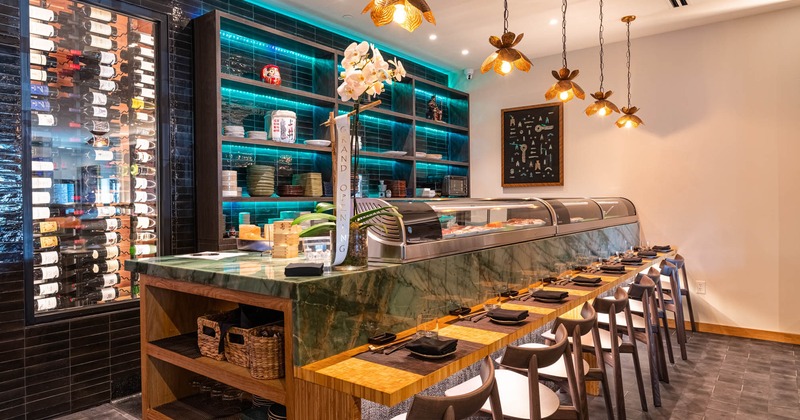 Interior, wine rack and food counter with seats and set table