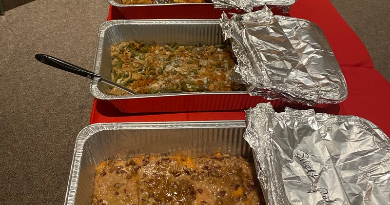 Assorted catering food trays on a table