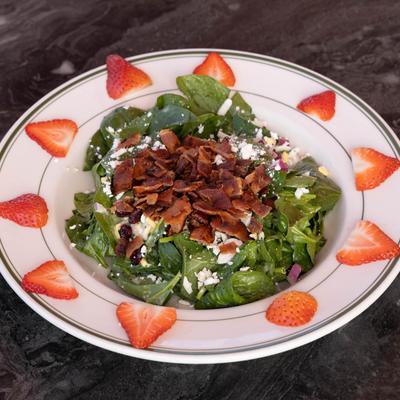 Spinach salad with bacon.