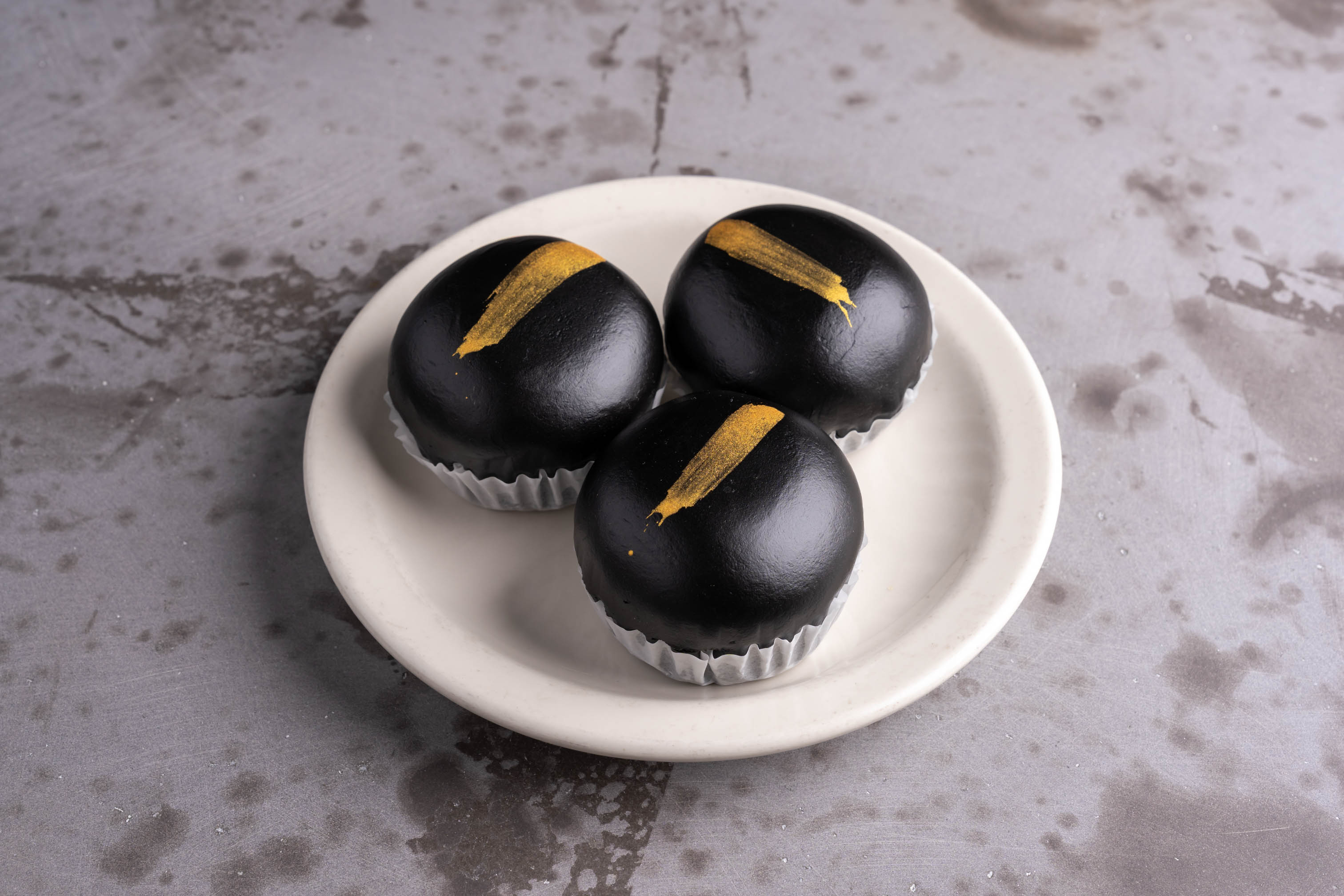 Black and Gold Molten Lava Buns