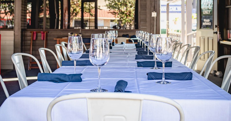 Interior, a long table for dining, table setting